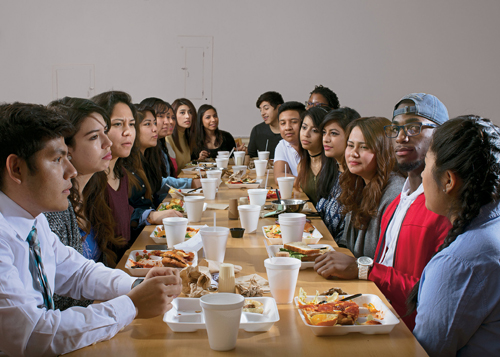 Some of the Opportunity Scholarship students gather for dinner at the Conrad Hall dining facility. - Photo by Angela Strassheim for The New York Times